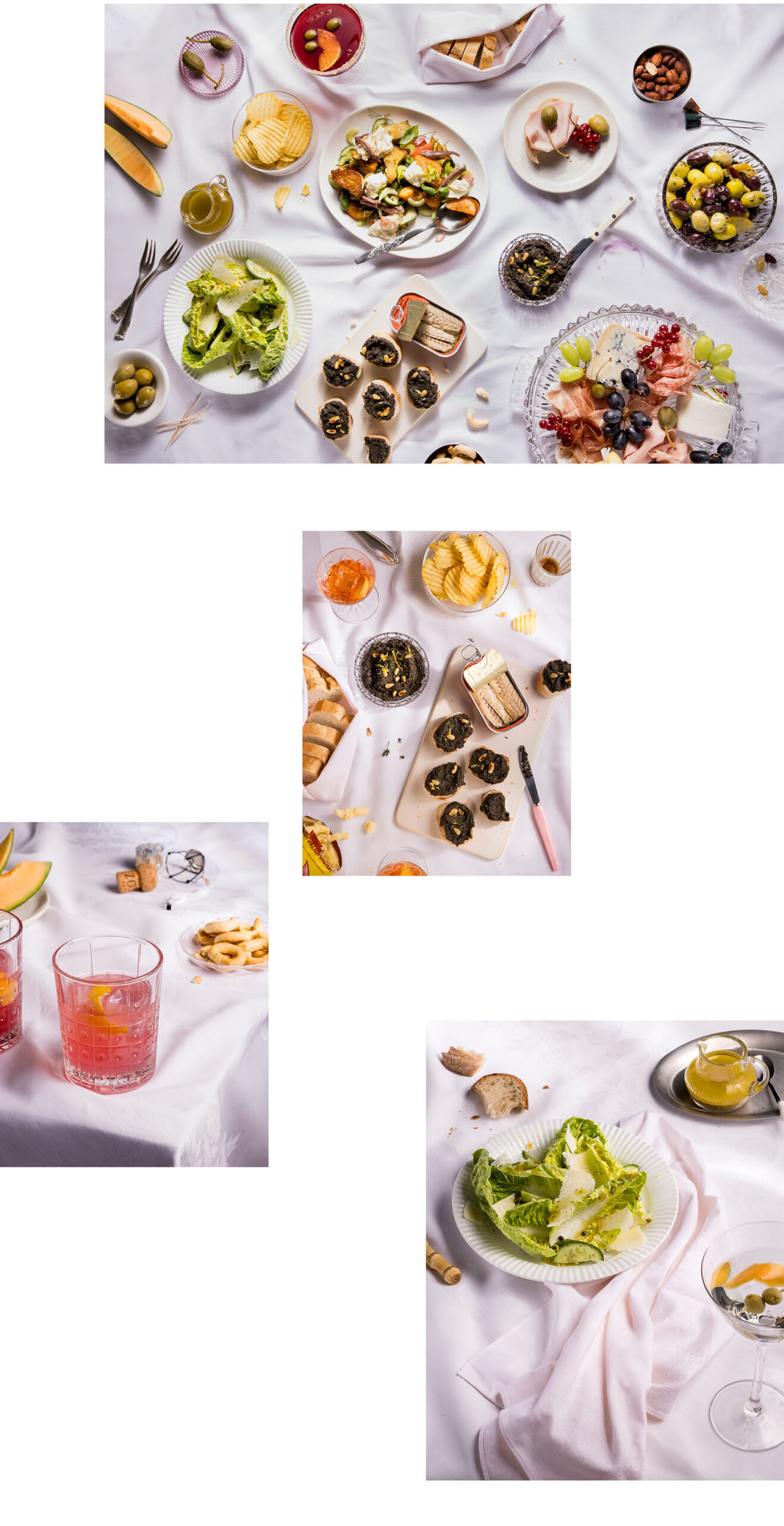 Gedeckter Tisch mit weißer Tischdecke und Aperitivo Gerichten